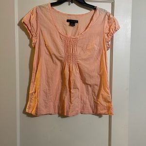 Calvin Klein light orange top. Good condition size small.